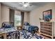 Bright bedroom featuring two twin beds with matching bedding, a blue patterned rug, and natural light at 8605 Hopper Ct., Myrtle Beach, SC 29579