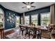 Cozy dining room with a large wooden table, metal chairs, and vintage Coca-Cola decor at 8605 Hopper Ct., Myrtle Beach, SC 29579