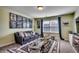 Inviting living room featuring a comfortable sofa, a large rug, and a display coffee table at 8605 Hopper Ct., Myrtle Beach, SC 29579