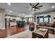 Open-concept living space with hardwood floors, stylish furnishings, and a seamless flow to the kitchen at 8605 Hopper Ct., Myrtle Beach, SC 29579