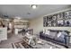 Spacious room featuring a comfortable sofa, a display coffee table, and a shelf for creative play and display at 8605 Hopper Ct., Myrtle Beach, SC 29579