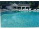 Large community swimming pool with clear blue water in front of the clubhouse at 8605 Hopper Ct., Myrtle Beach, SC 29579