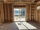 Interior framing with a sliding glass door revealing a lake view at 1020 Clamour Ct., Conway, SC 29526