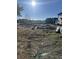 Large lot being prepped for construction in a desirable neighborhood with mature trees and sunny skies at 1020 Clamour Ct., Conway, SC 29526