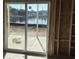 Sliding glass doors provide seamless access to the outdoor waterfront view and natural light at 1020 Clamour Ct., Conway, SC 29526