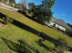 Sloping grassy yard with potential for landscaping, and a black fence, offering privacy and curb appeal at 1020 Clamour Ct., Conway, SC 29526