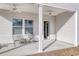 A covered back porch with comfortable seating and ceiling fans at 134 Hancher Dr., Myrtle Beach, SC 29588