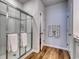 Modern bathroom featuring a glass enclosed shower with wood flooring at 134 Hancher Dr., Myrtle Beach, SC 29588
