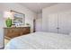 Bedroom with wood dresser, artwork, and natural lighting at 134 Hancher Dr., Myrtle Beach, SC 29588