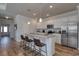Modern kitchen featuring stainless steel appliances, granite countertops, and a breakfast bar with seating at 134 Hancher Dr., Myrtle Beach, SC 29588