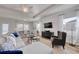 Bright living room with tray ceilings, comfortable seating and an adjacent dining area at 134 Hancher Dr., Myrtle Beach, SC 29588