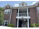 Brick building exterior with white columns and balcony at 2013 Silvercrest Dr. # 30-A, Myrtle Beach, SC 29579