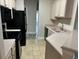 Open kitchen with black appliances and light countertops at 2013 Silvercrest Dr. # 30-A, Myrtle Beach, SC 29579