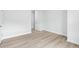 Spacious bedroom with wood-look floors and a door at 2040 Copper Creek Loop, Longs, SC 29568