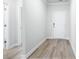 Bright entryway with light gray walls and wood-look flooring at 2040 Copper Creek Loop, Longs, SC 29568