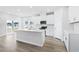 Modern kitchen with white cabinets, island, and stainless steel appliances at 2040 Copper Creek Loop, Longs, SC 29568