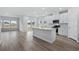 Modern kitchen featuring white cabinets, quartz countertops, and stainless steel appliances at 2040 Copper Creek Loop, Longs, SC 29568