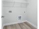 Laundry room with vinyl flooring and wire shelving at 2040 Copper Creek Loop, Longs, SC 29568