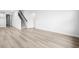 Open living room with hardwood flooring and staircase to upper level at 2040 Copper Creek Loop, Longs, SC 29568