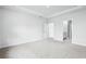 Spacious main bedroom with carpeted floor and access to bathroom at 2040 Copper Creek Loop, Longs, SC 29568