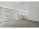 Bonus room with neutral walls, plush carpeting, and multiple windows for natural light at 2048 Copper Creek Loop, Longs, SC 29568