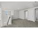 Neutral bonus room with plush carpeting, light walls and access to another room at 2048 Copper Creek Loop, Longs, SC 29568