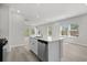 Bright open-concept kitchen area with stainless steel dishwasher and island with seating area at 2048 Copper Creek Loop, Longs, SC 29568