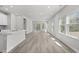 Bright and open living room featuring luxury vinyl plank flooring and plenty of natural light at 2048 Copper Creek Loop, Longs, SC 29568