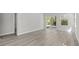 Open living space with vinyl floors and sliding glass doors that lead to a patio at 2048 Copper Creek Loop, Longs, SC 29568