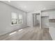 Sunlit living room featuring wood flooring, bright neutral paint, and plenty of windows for natural light at 2048 Copper Creek Loop, Longs, SC 29568