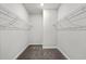 Spacious walk-in closet with wire shelving on both sides and plush carpeting at 2048 Copper Creek Loop, Longs, SC 29568