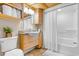 Clean bathroom with tub shower, wood cabinets, and updated fixtures at 205 74Th Ave. N # 1601, Myrtle Beach, SC 29572