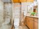 Updated bathroom with walk-in shower, tile flooring, and light wood cabinets at 205 74Th Ave. N # 1601, Myrtle Beach, SC 29572