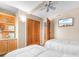 Twin bedroom with TV, built-in shelving, and access to a bathroom at 205 74Th Ave. N # 1601, Myrtle Beach, SC 29572