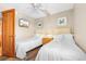 Guest bedroom with two twin beds, ceiling fan, and coastal decor at 205 74Th Ave. N # 1601, Myrtle Beach, SC 29572