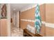 Inviting entryway with bench, hooks, and beach towel at 205 74Th Ave. N # 1601, Myrtle Beach, SC 29572