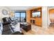 Relaxing living room with ocean view, comfy seating, and built-in entertainment center at 205 74Th Ave. N # 1601, Myrtle Beach, SC 29572