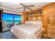 Spacious main bedroom with ocean view, king-size bed, and built-in cabinetry at 205 74Th Ave. N # 1601, Myrtle Beach, SC 29572