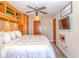 Bright bedroom with king-size bed and built-in wood cabinets at 205 74Th Ave. N # 1601, Myrtle Beach, SC 29572