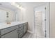 Bathroom with double vanity and grey cabinets at 267 Starlit Way, Myrtle Beach, SC 29579