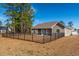 Home features a fenced backyard with mature trees and landscaping at 363 Long Meadow Dr., Loris, SC 29569