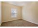 Spacious bedroom with neutral walls and carpet, featuring a window with blinds at 363 Long Meadow Dr., Loris, SC 29569