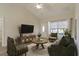 Living room with green sofas and a wooden coffee table at 363 Long Meadow Dr., Loris, SC 29569