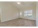 Spacious living room with hardwood floors and large windows at 363 Long Meadow Dr., Loris, SC 29569