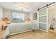 Spacious bedroom with a queen bed and an ensuite bathroom with barn door at 3762 Citation Way # 1018, Myrtle Beach, SC 29577