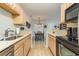 Well-equipped kitchen offering ample cabinet space and a dining area view at 3762 Citation Way # 1018, Myrtle Beach, SC 29577