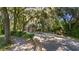 Entrance to Wedgefield Plantation with brick guard house and lush greenery at 92 Patriot Ct., Georgetown, SC 29440