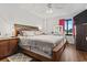 Spacious bedroom with king-size bed and wood dresser at 400 20Th Ave. N # 303, Myrtle Beach, SC 29577