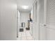 Hallway with white cabinets and tile floor leading to kitchen at 400 20Th Ave. N # 303, Myrtle Beach, SC 29577
