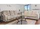 Living room with hardwood floors, sofas, and coffee table at 400 20Th Ave. N # 303, Myrtle Beach, SC 29577